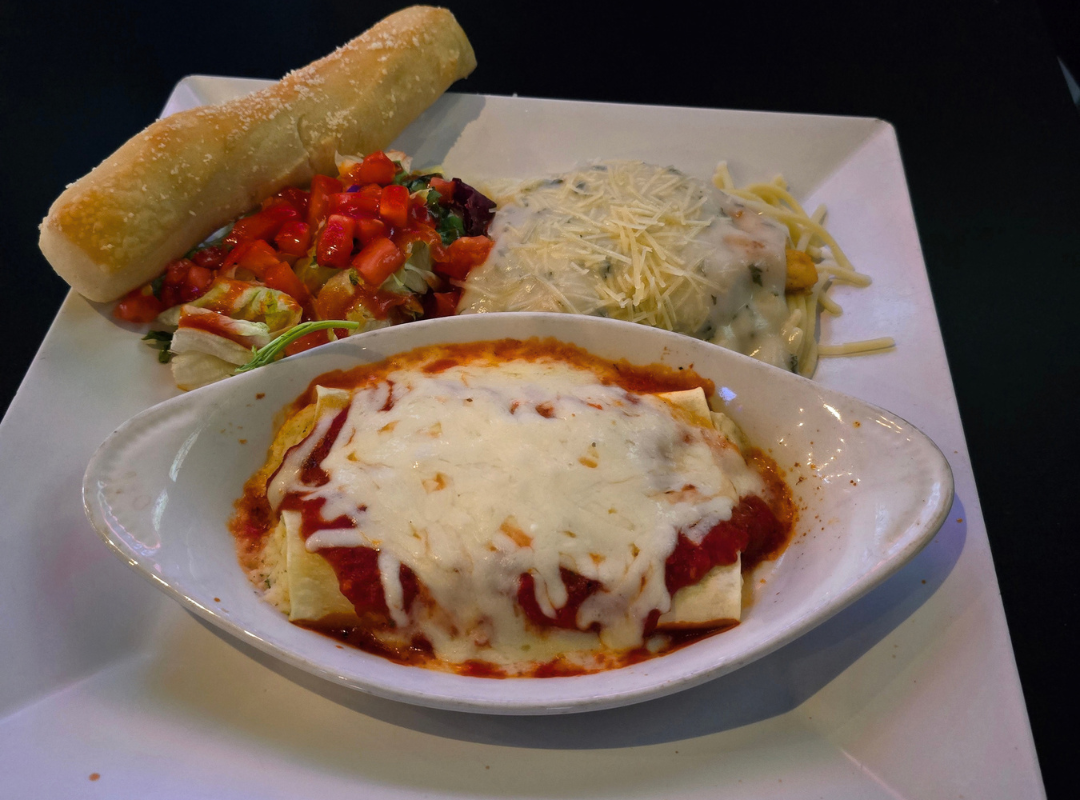 Italian Thursday trio plate at Bogey's Sports Pub in Venice, FL - baked lasagna with marinara, creamy Alfredo pasta, fresh house salad, and a warm breadstick